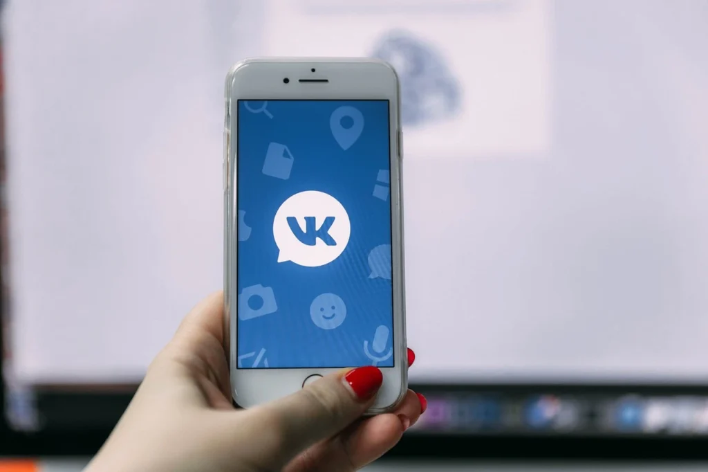 Pavel Durov's VKontakte app logo and theme displayed on a smartphone screen